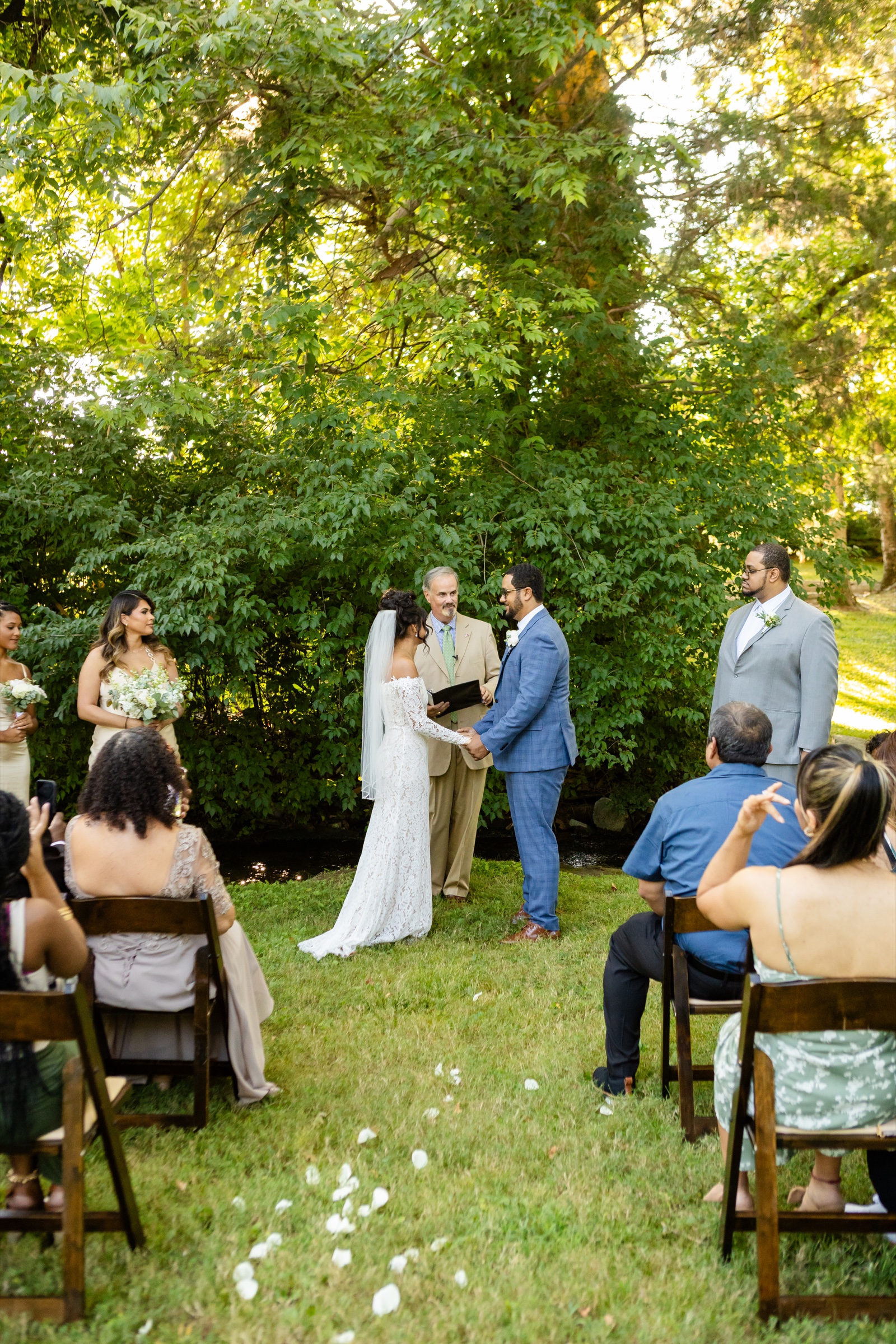Couple exchanging vows at garden ceremony