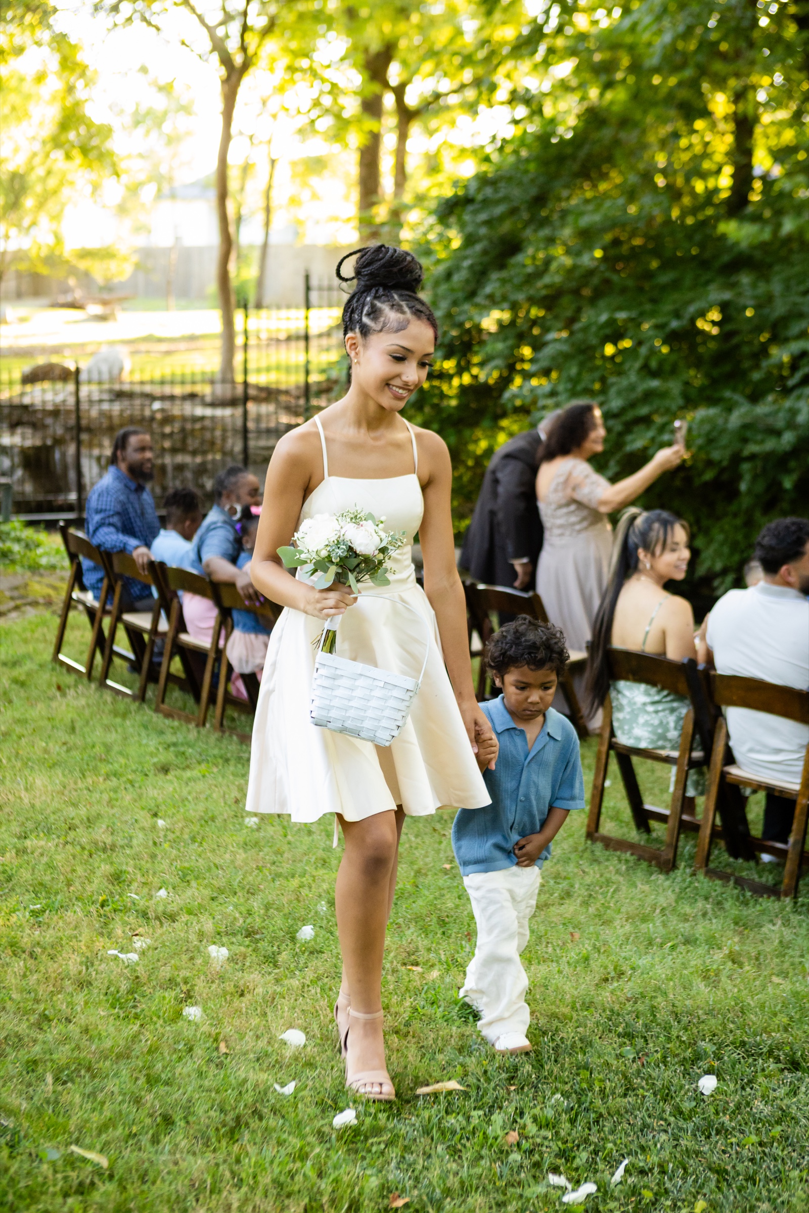 Flower girl and ring bearer walking down the aisle