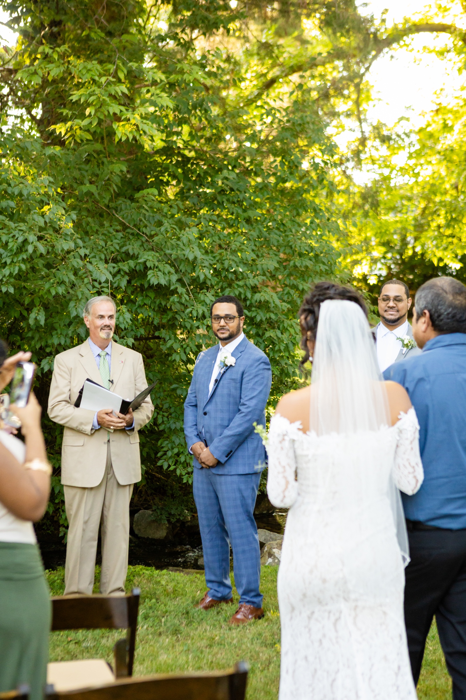 Groom seeing bride for the first time at ceremony