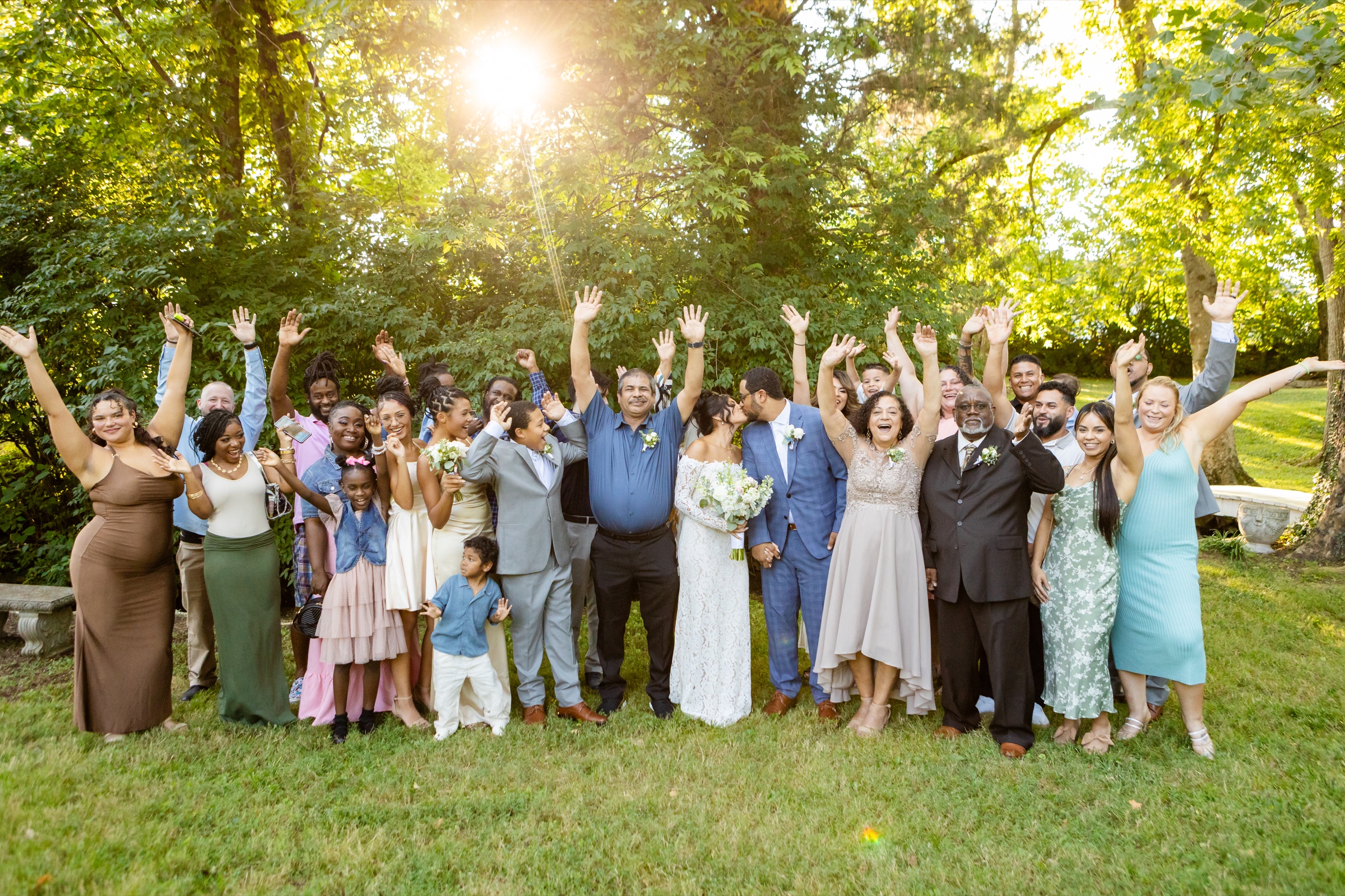 Wedding party group photo with everyone celebrating